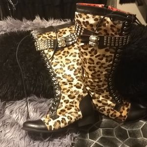 Leopard knee high combat boots.